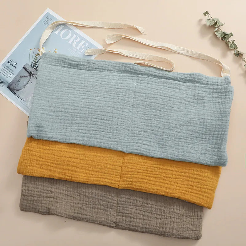 Organisateur de lit bébé multi-poches pour couches et accessoires