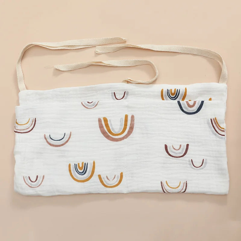 Organisateur de lit bébé multi-poches pour couches et accessoires